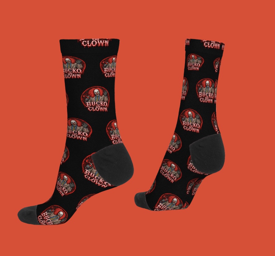 Black Bucko crew socks, repeating circular clown logos on orange background